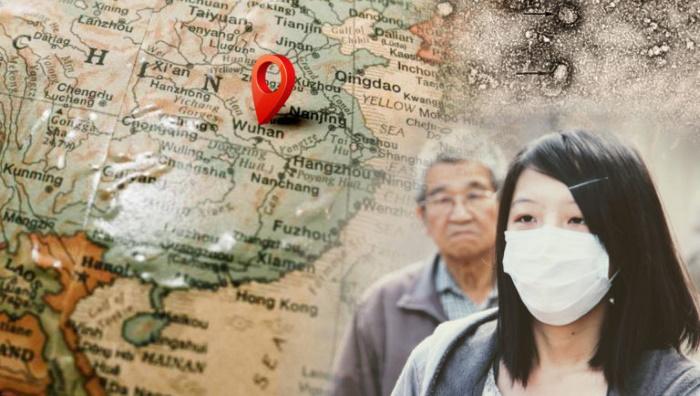 Kiinan kartta ja nainen, jolla on hengityssuojain.